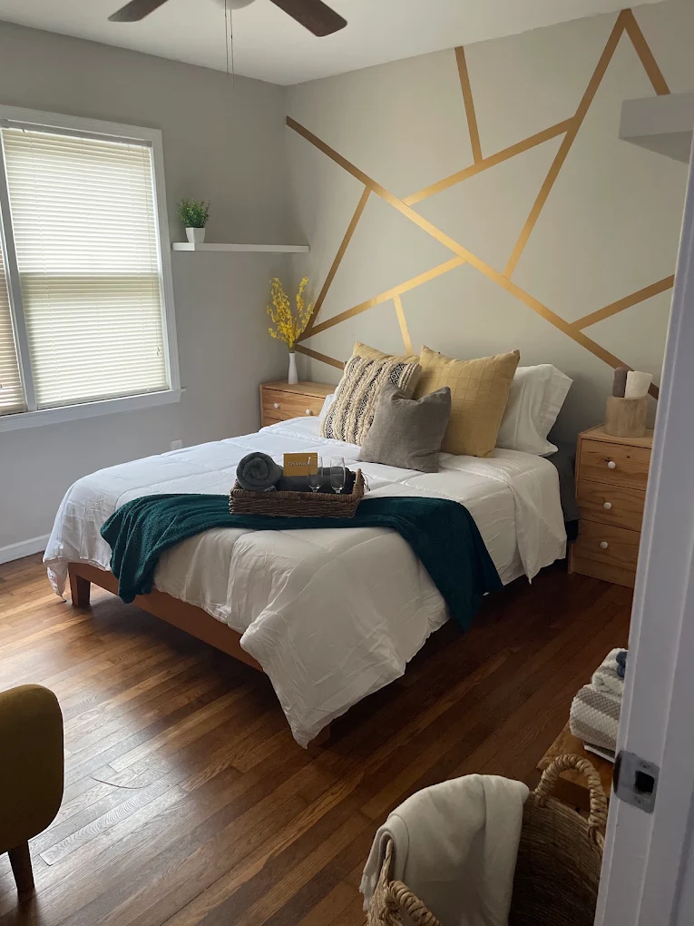 Guest bedroom staged and turned over with fresh linens and a welcome tray